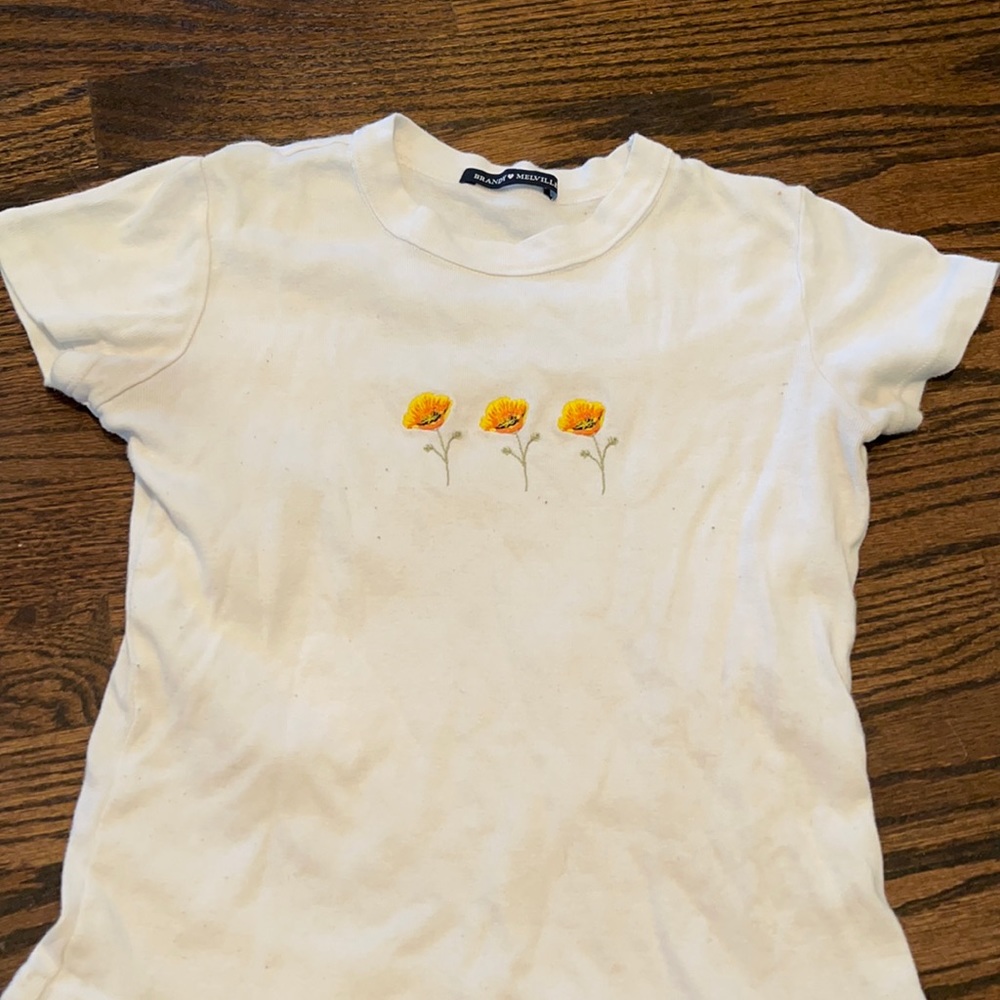 White croped brandy shirt with flowers on it